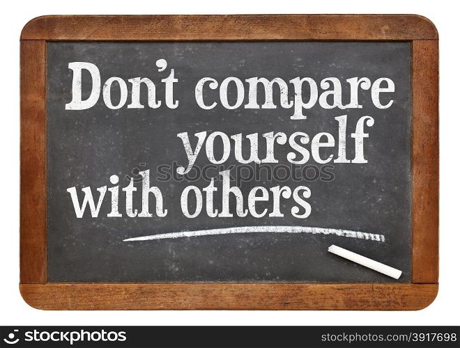 Do not compare yourself with others- motivational advice on a vintage slate blackboard