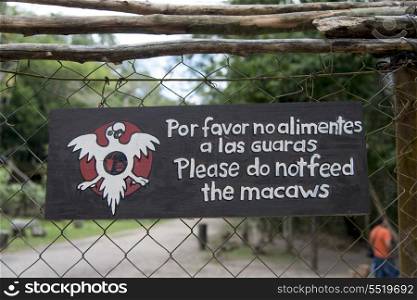 Do not feed macaw sign on a fence, Copan, Copan Ruinas, Copan Department, Honduras