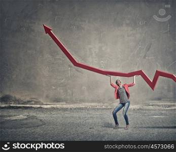 Do not let it fall. Young woman in red jacket lifting red growing arrow