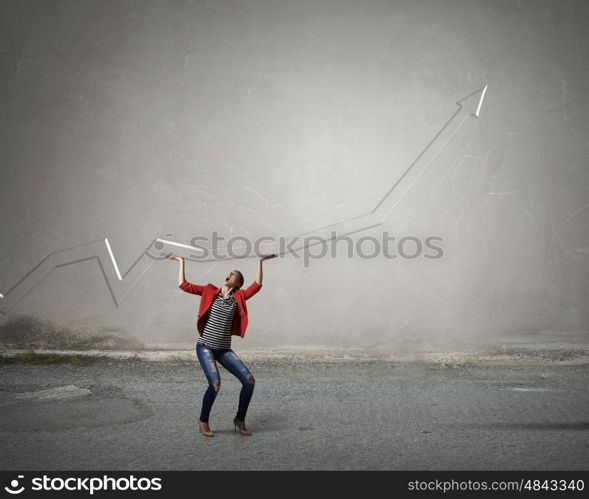 Do not let it fall. Young woman in red jacket looking at red growing arrow