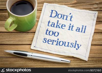 Do not take it all too seriously - handwriting on a napkin with a cup of espresso coffee
