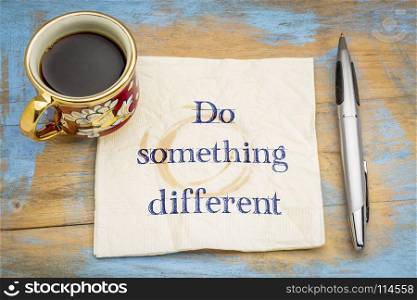 Do something different advice - handwriting on a napkin with a cup of coffee