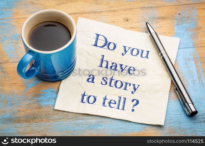 Do you have a story to tell? Handwriting on a napkin with a cup of espresso coffee