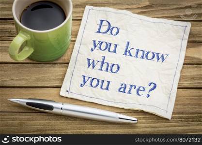 Do you know who you are ? A question on a napkin with a cup of coffee.