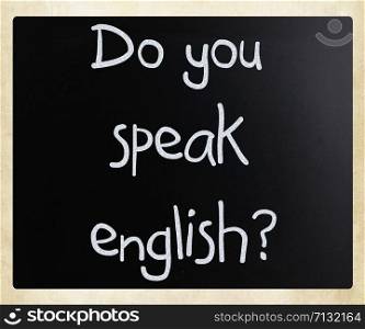""Do you speak english" handwritten with white chalk on a blackboard"