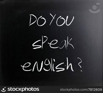 ""Do you speak english" handwritten with white chalk on a blackboard."