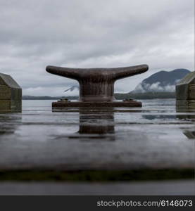 Dock cleat with boathouses, Pacific Rim National Park Reserve, Tofino, Vancouver Island, British Columbia, Canada