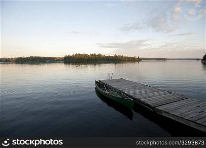 Dock in the water with horizon sky at Lake of the Woods, Ontario