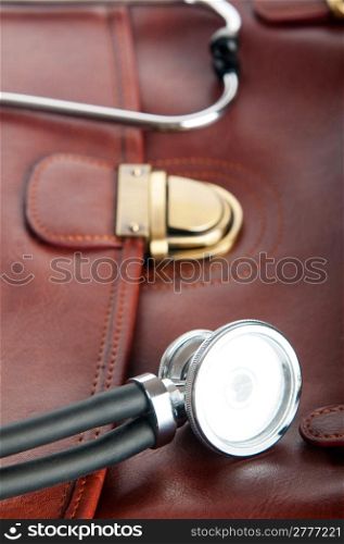 Doctor&acute;s brown leather case with the stethoscope