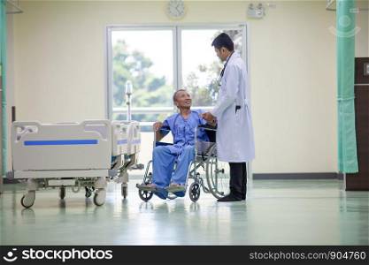 Doctor advising patient in hospital office during regular medical exam, health care and prevention concept., technology and medical health care concept.