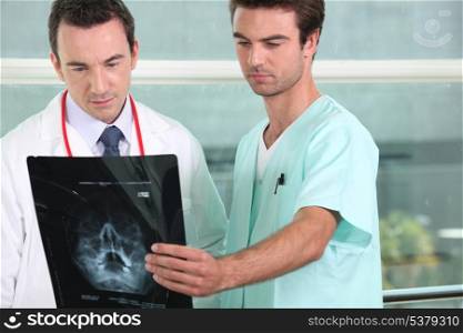 Doctor and a nurse looking at xray