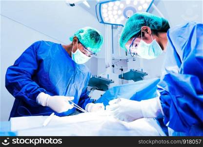 Doctor and assistant nurse operating for help patient from dangerous emergency case, Hospital and Surgery Concept, Health care and Medical concept, Cancer and disease treatment