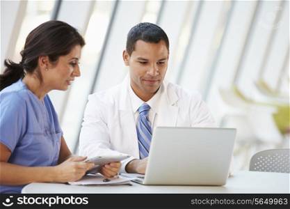 Doctor And Nurse Having Informal Meeting In Hospital Canteen