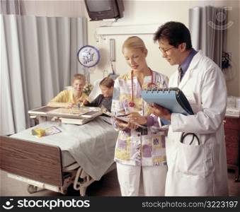 Doctor and Nurse in Hospital Room