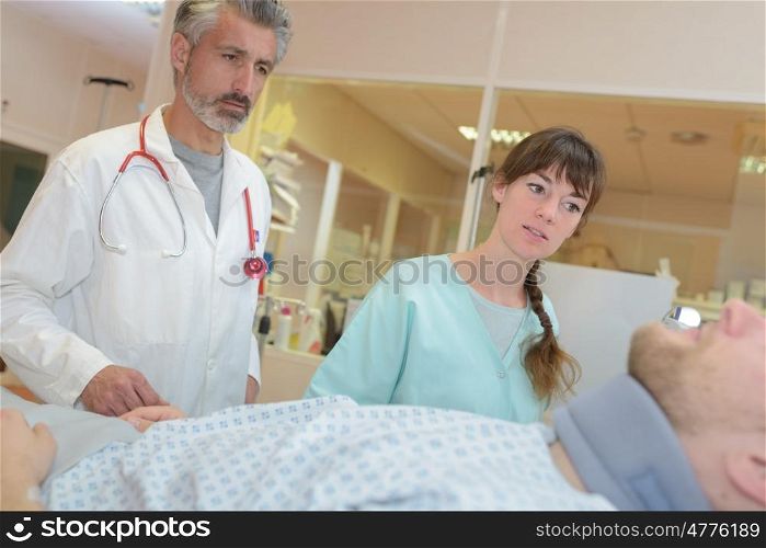 doctor and nurse interacting with each other in hospital room