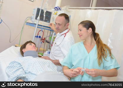 doctor and nurse visiting a recovering patient