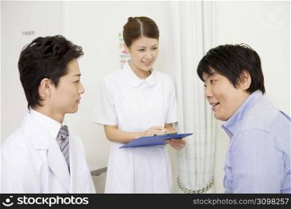 Doctor and nurse with a patient
