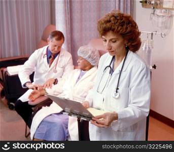 Doctor and Nurse with Patient