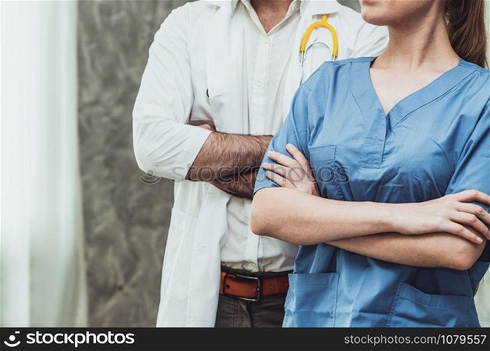 Doctor and nurse working in hospital. Healthcare and medical staff service concept.