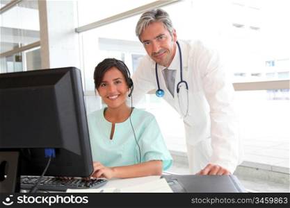 Doctor and nurse working in office