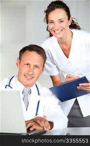 Doctor and nurse working in the office