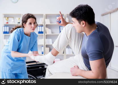 Doctor and patient during check-up for injury in hospital