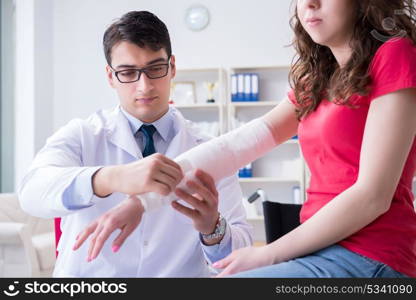 Doctor and patient during check-up for injury in hospital