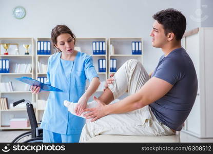 Doctor and patient during check-up for injury in hospital