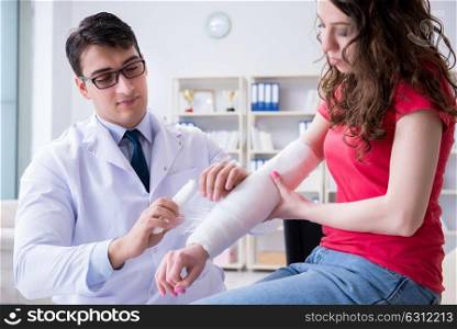 Doctor and patient during check-up for injury in hospital. The doctor and patient during check-up for injury in hospital