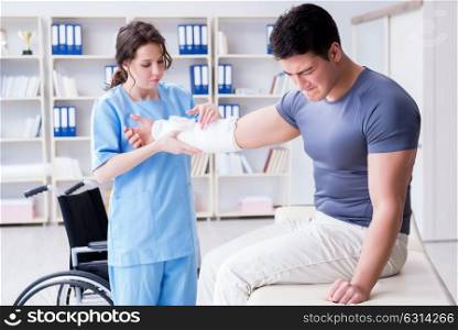 Doctor and patient during check-up for injury in hospital