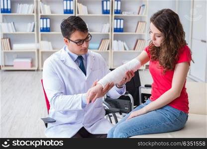 Doctor and patient during check-up for injury in hospital. The doctor and patient during check-up for injury in hospital