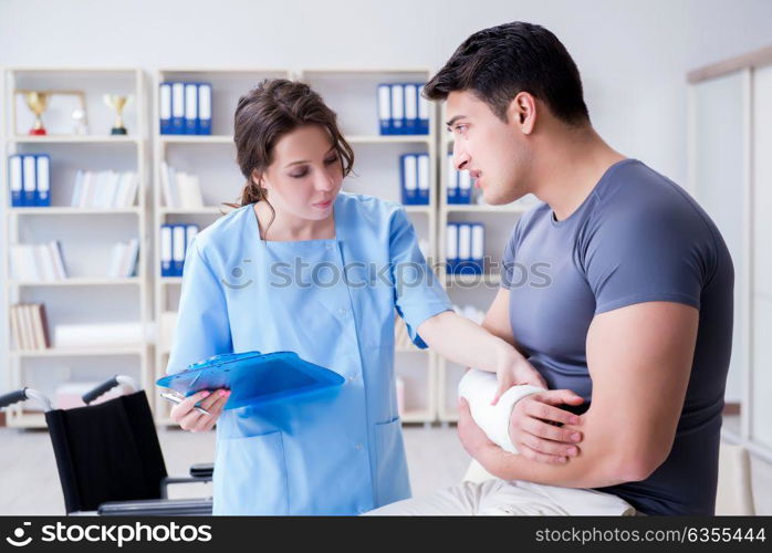 Doctor and patient during check-up for injury in hospital