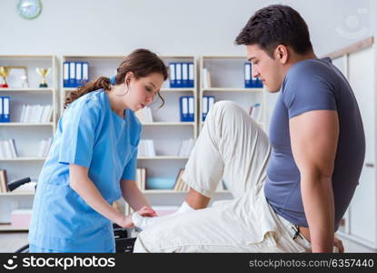 Doctor and patient during check-up for injury in hospital