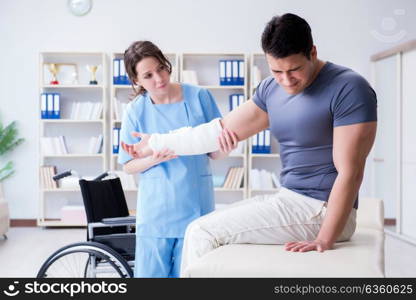 Doctor and patient during check-up for injury in hospital. The doctor and patient during check-up for injury in hospital