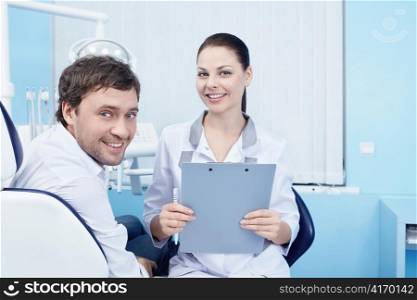 Doctor and patient in the dental clinic
