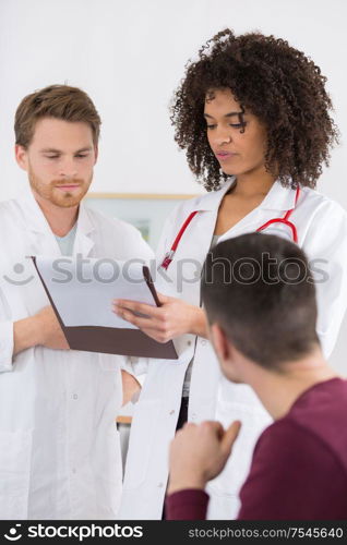 doctor and patient talking in office