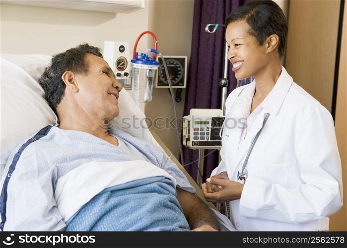 Doctor And Patient Talking To Each Other,Smiling