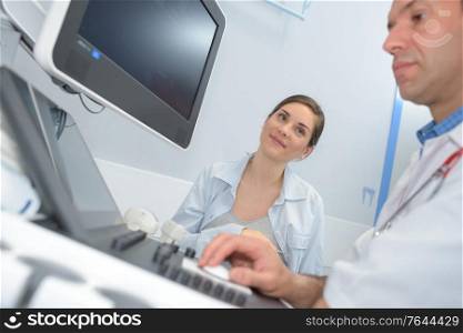 doctor and patient ultrasound equipment diagnostics sonography