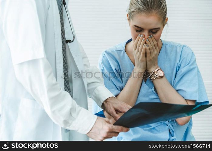 Doctor and unhappy patient at hospital or medical clinic . Healthcare medical malpractice and failure concept.