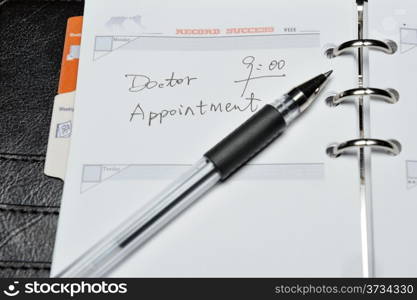 Doctor appointment words written on notebook
