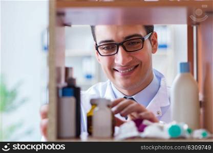 Doctor at farmacy retail shop looking for medicines