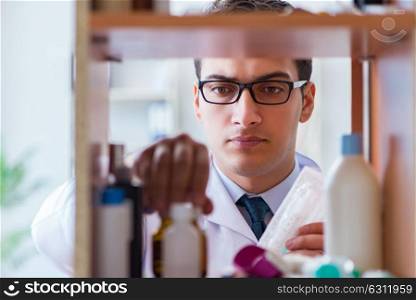 Doctor at farmacy retail shop looking for medicines. The doctor at farmacy retail shop looking for medicines