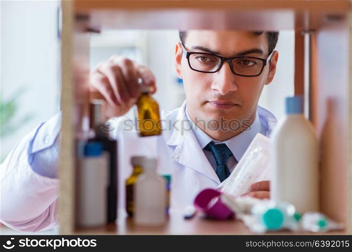Doctor at farmacy retail shop looking for medicines