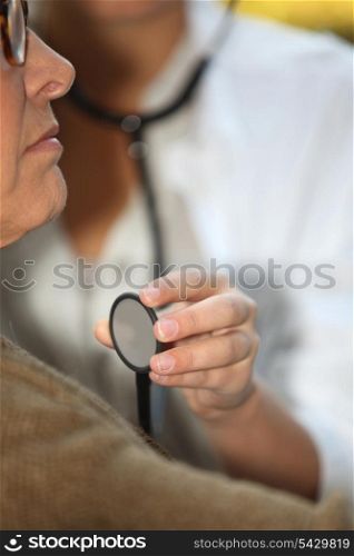 Doctor auscultating