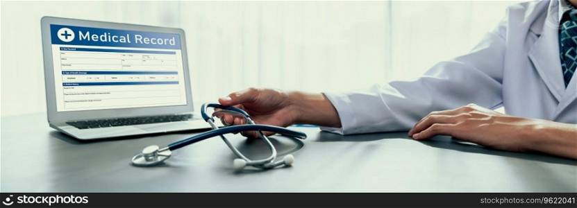 Doctor carefully review detailed medical report on laptop and diagnosing illness for effective healthcare treatment plan for patient in doctor office. Professional medical evaluation. Neoteric. Doctor carefully review detailed medical report on laptop. Neoteric