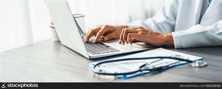 Doctor carefully review detailed medical report with laptop and diagnosing illness for effective healthcare treatment plan for patient in doctor office. Professional medical evaluation. Neoteric. Doctor carefully review detailed medical report with laptop. Neoteric