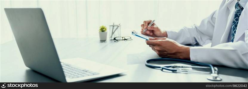 Doctor carefully review detailed medical report with laptop and diagnosing illness for effective healthcare treatment plan for patient in doctor office. Professional medical evaluation. Neoteric. Doctor carefully review detailed medical report with laptop. Neoteric