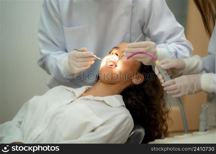 Doctor checking a patient?s teeth in dental clinic,People,Medicine,Stomatology and health care concept.