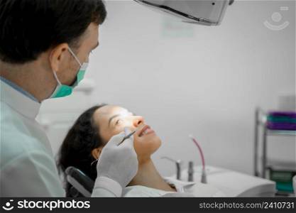 Doctor checking a patient?s teeth in dental clinic,People,Medicine,Stomatology and health care concept.