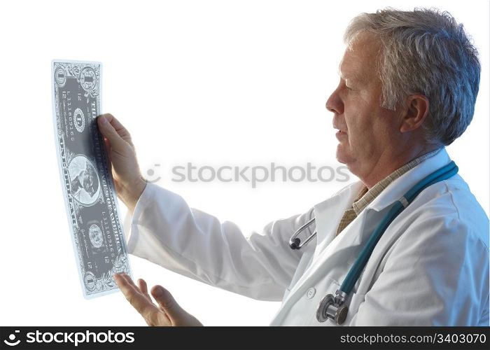 Doctor checking dollar x-ray in the light.